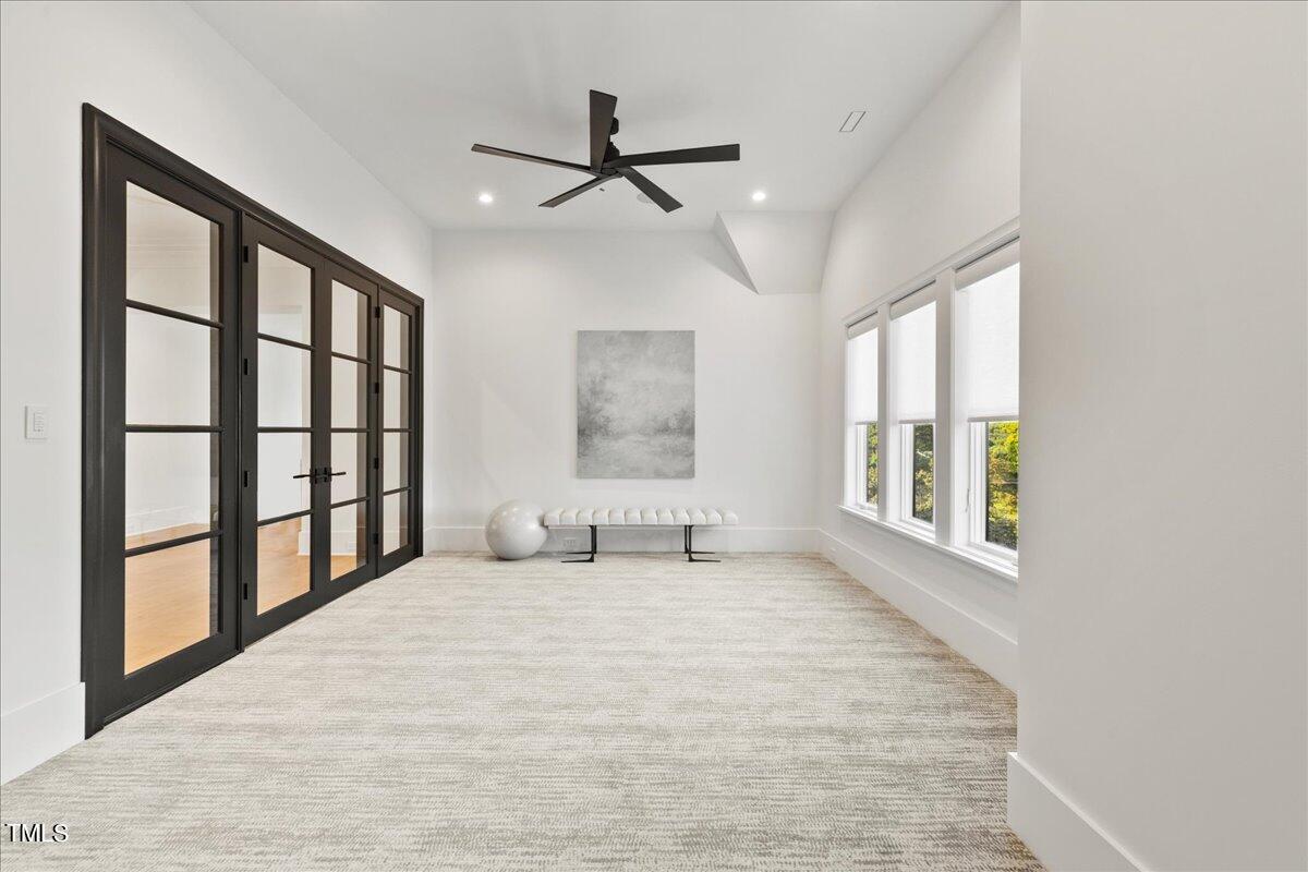 222 Reynolds Road Raleigh, NC 27609 - Photo 29 of 43 a large white bed in a room next to a window