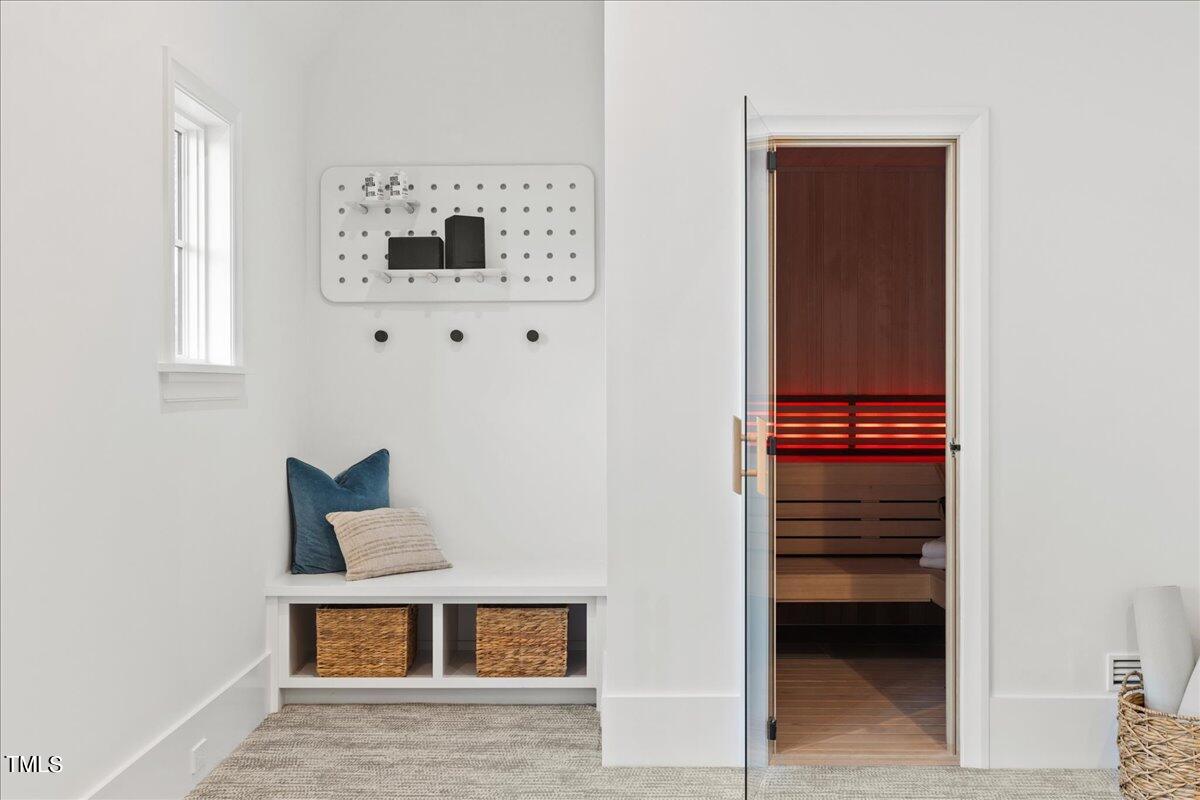 222 Reynolds Road Raleigh, NC 27609 - Photo 30 of 43 a view of hallway with a bed and a cabinet