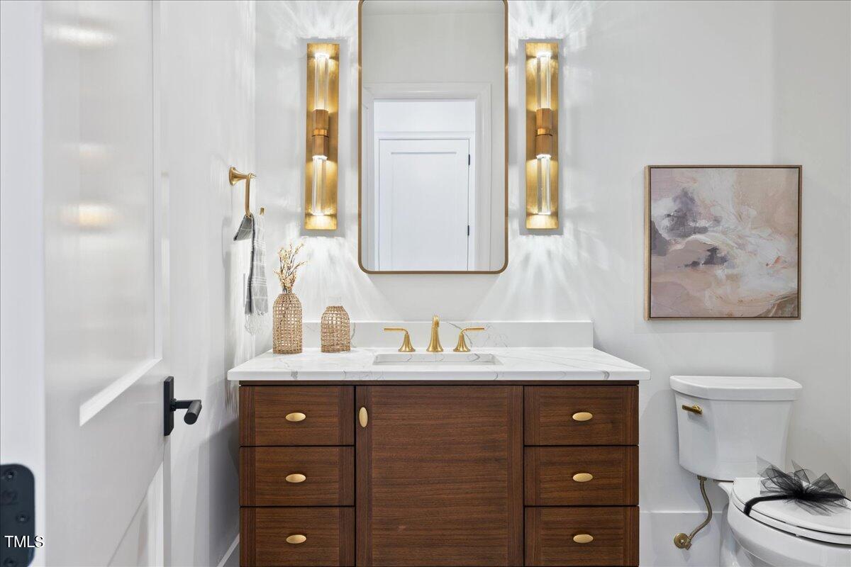 222 Reynolds Road Raleigh, NC 27609 - Photo 33 of 43 a bathroom with a sink and a mirror
