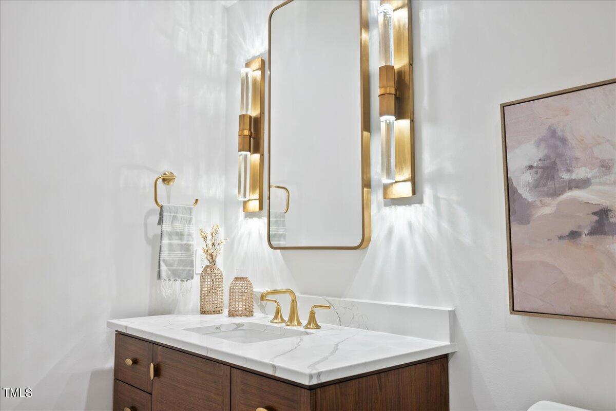 222 Reynolds Road Raleigh, NC 27609 - Photo 34 of 43 a bathroom with a sink and a mirror