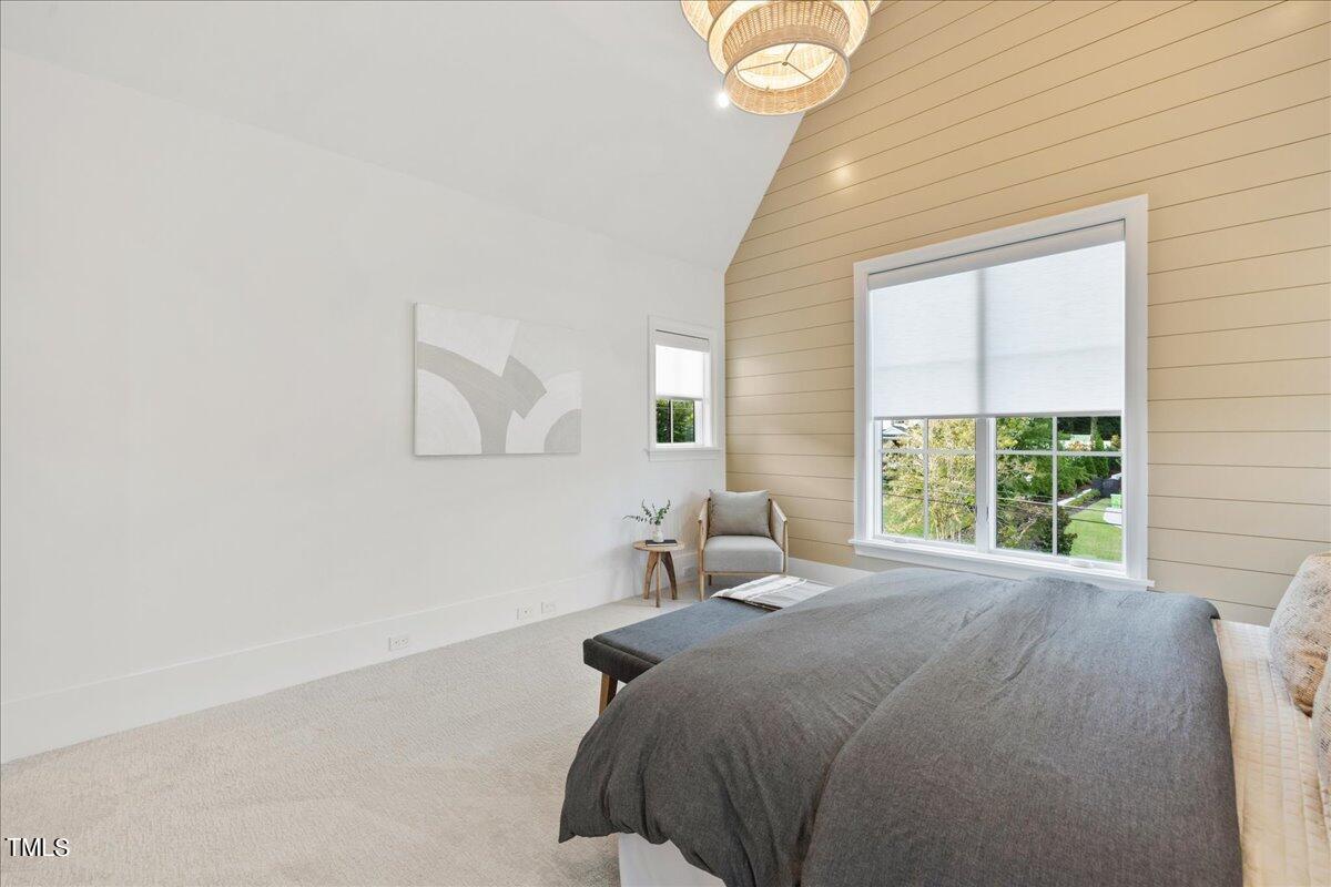 222 Reynolds Road Raleigh, NC 27609 - Photo 35 of 43 a bedroom with a bed and a large window