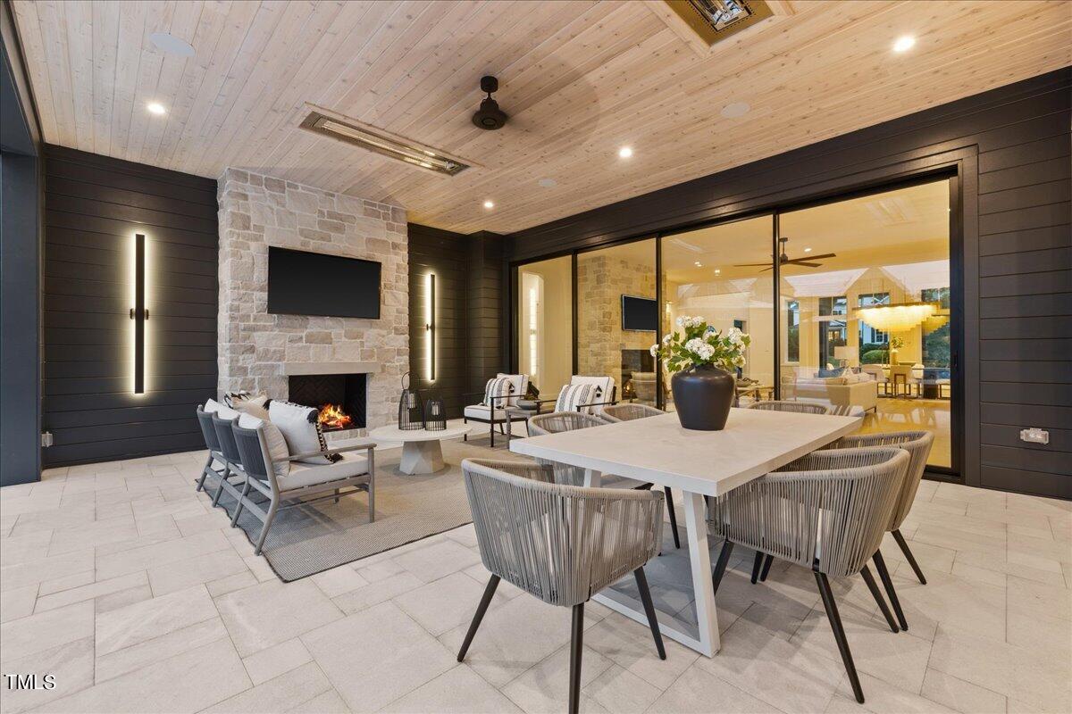 222 Reynolds Road Raleigh, NC 27609 - Photo 38 of 43 a view of a dining room with furniture window and outside view