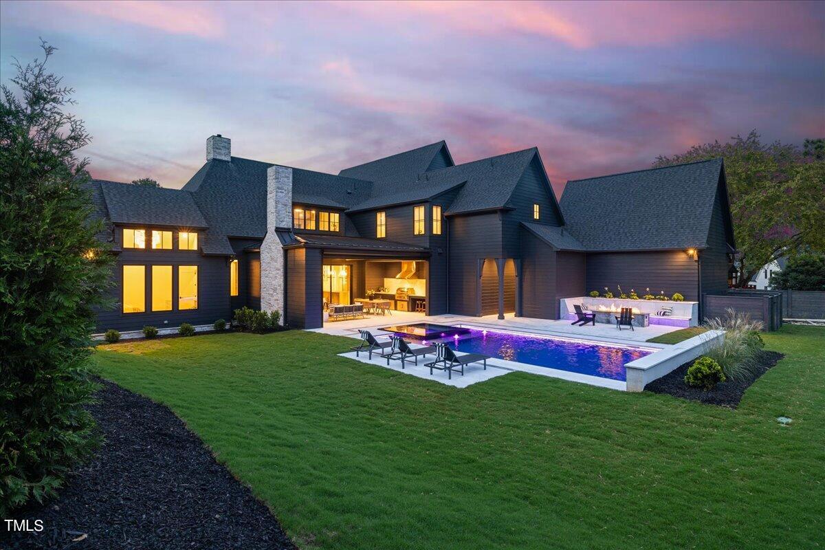 222 Reynolds Road Raleigh, NC 27609 - Photo 4 of 43 a backyard of a house with table and chairs
