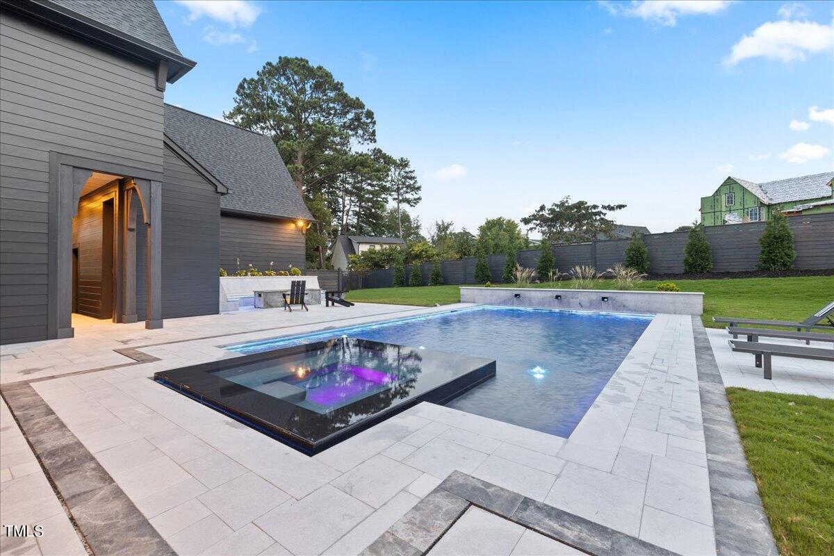 222 Reynolds Road Raleigh, NC 27609 - Photo 42 of 43 a view of a swimming pool with a patio