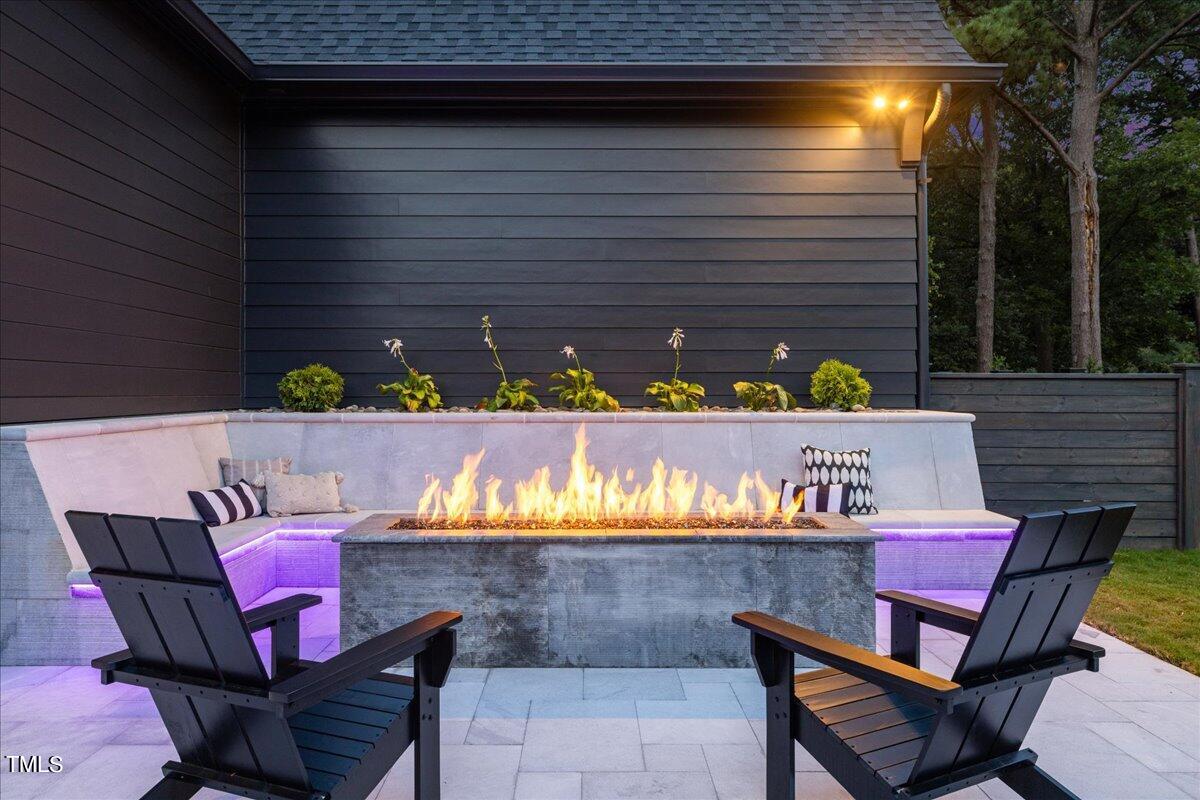 222 Reynolds Road Raleigh, NC 27609 - Photo 6 of 43 a view of a chairs and table in the patio