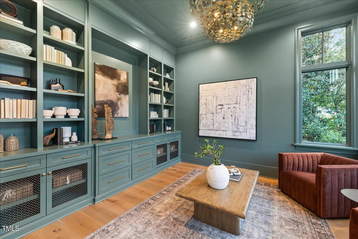 222 Reynolds Road Raleigh, NC 27609 - Photo 7 of 43 a room with a bookshelf window and couch