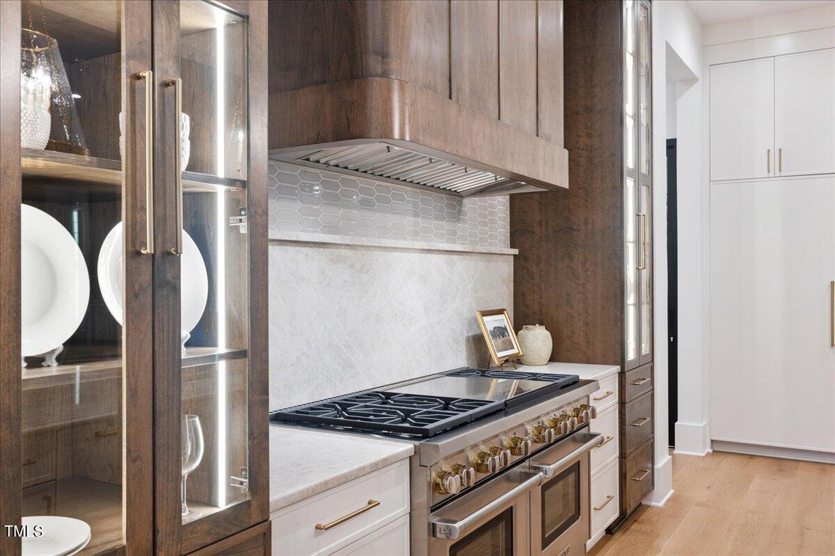 222 Reynolds Road Raleigh, NC 27609 - Photo 10 of 43 a kitchen with stainless steel appliances granite countertop a stove and a refrigerator