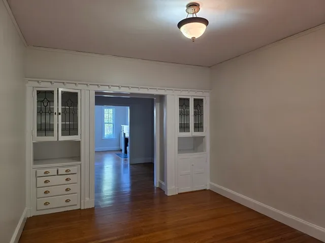 wooden floor in an empty room and a window