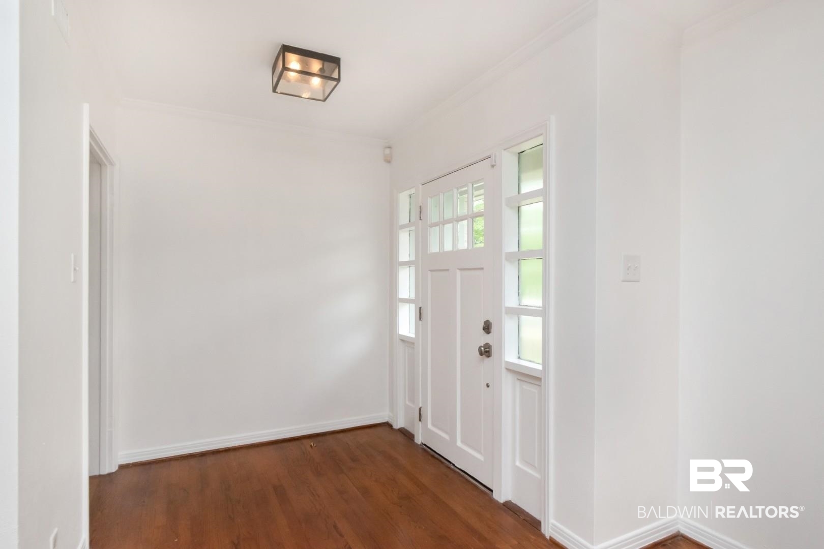 4 Turnout Lane Mobile, AL 36608 - Photo 3 of 53 Entryway with dark wood-style floors and crown molding