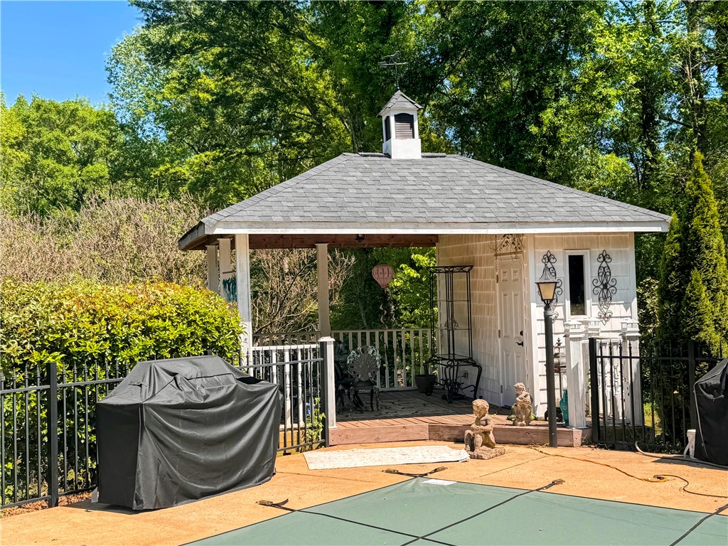 208 Knoxwood Court Anderson, SC 29621 - Photo 33 of 38 This charming pool house with a welcoming porch creates an ideal outdoor retreat.