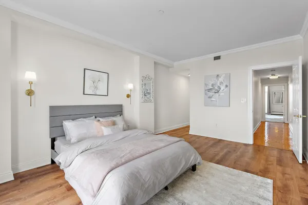 a view of a room with wooden floor and closet