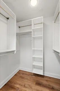 a view of a room with wooden floor and closet