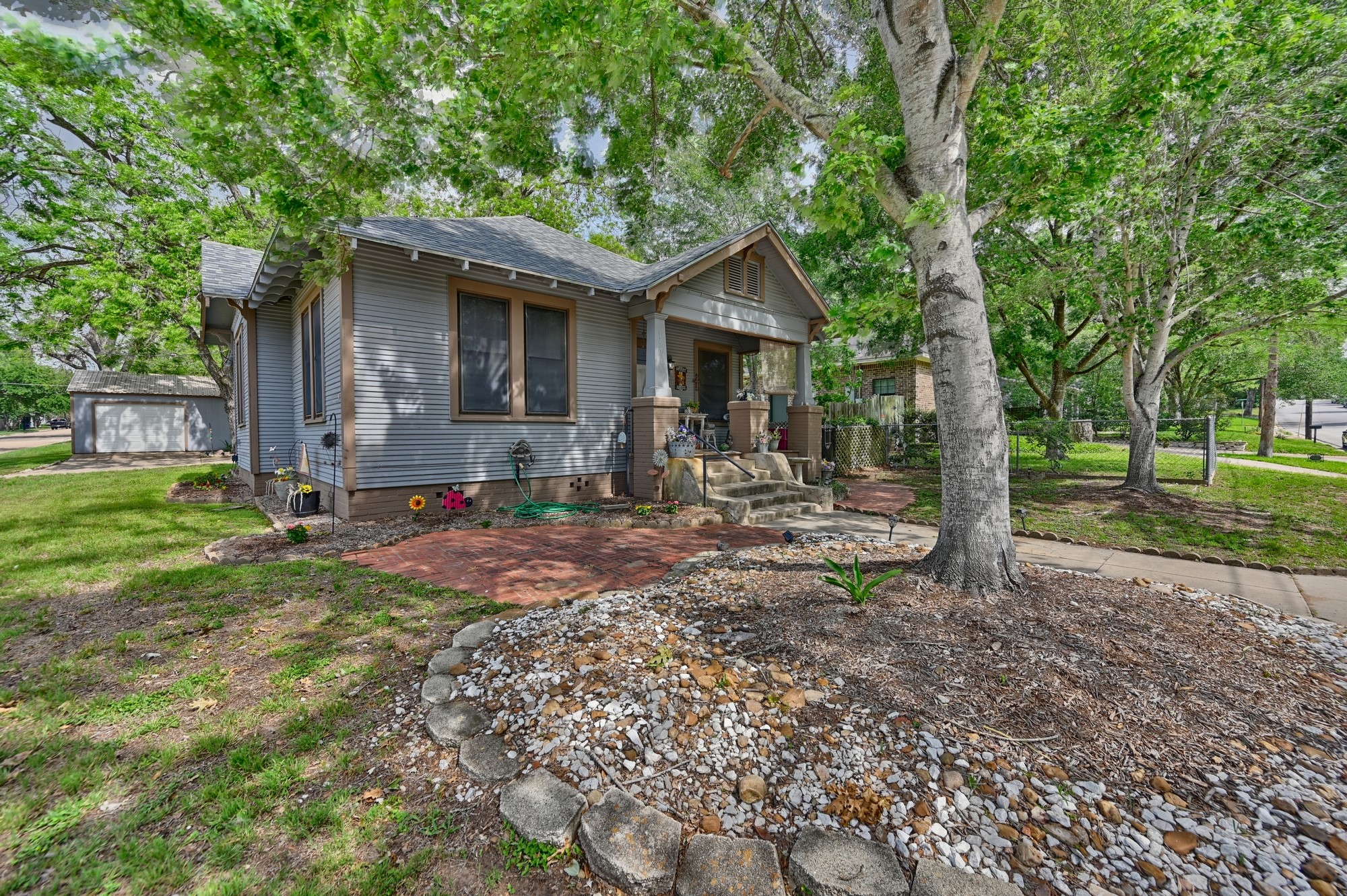 1501 South Austin Street Brenham, TX 77833 - Photo 35 of 36 a front view of a house with a yard and trees
