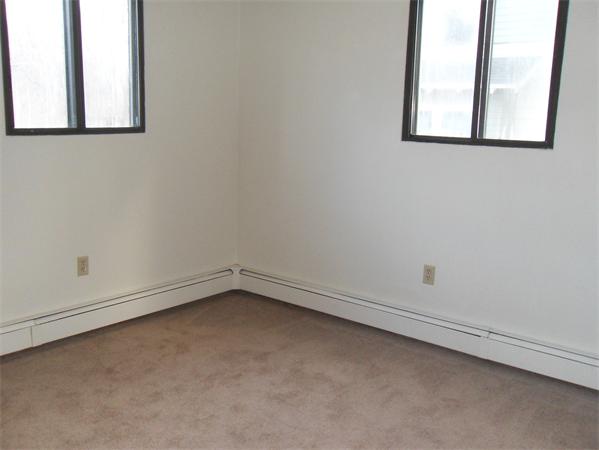 512-514 Gleasondale Road Stow, MA 01775 - Photo 11 of 16 an empty room with a window