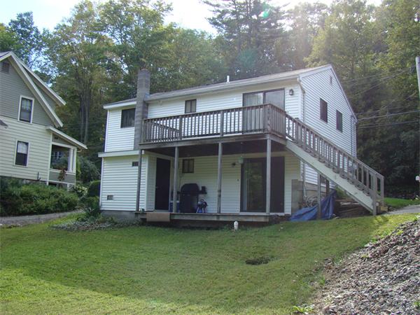 512-514 Gleasondale Road Stow, MA 01775 - Photo 13 of 16 a view of a house with a yard plants and large tree