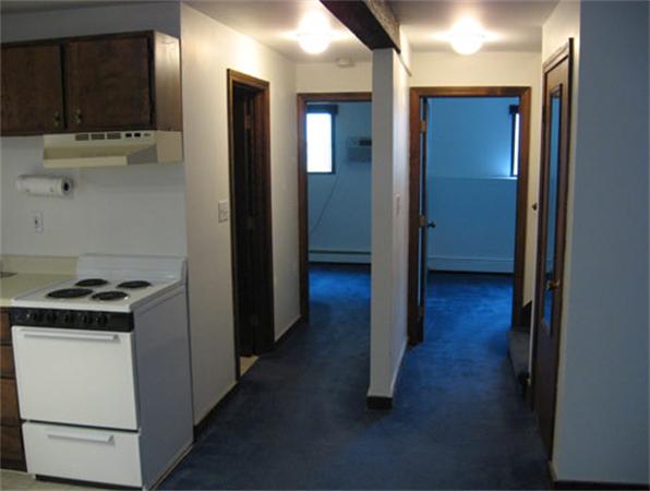 512-514 Gleasondale Road Stow, MA 01775 - Photo 5 of 16 a kitchen with a refrigerator and a stove