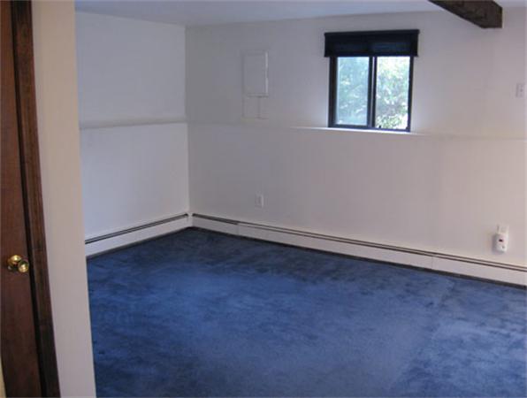 512-514 Gleasondale Road Stow, MA 01775 - Photo 6 of 16 an empty room with a window