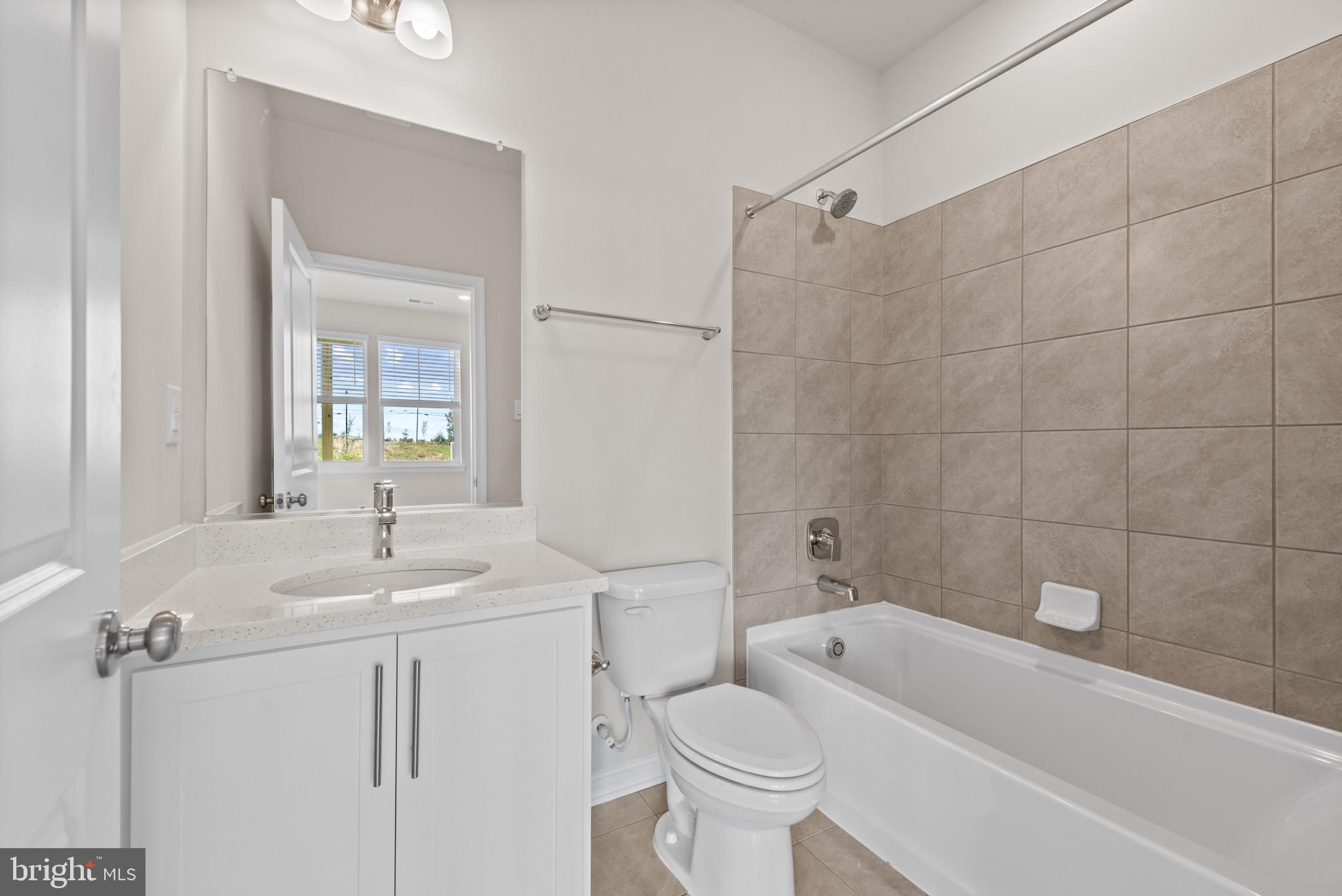 762 Union Street Frederick, MD 21701 - Photo 6 of 34 a bathroom with a sink toilet a shower and bathtub