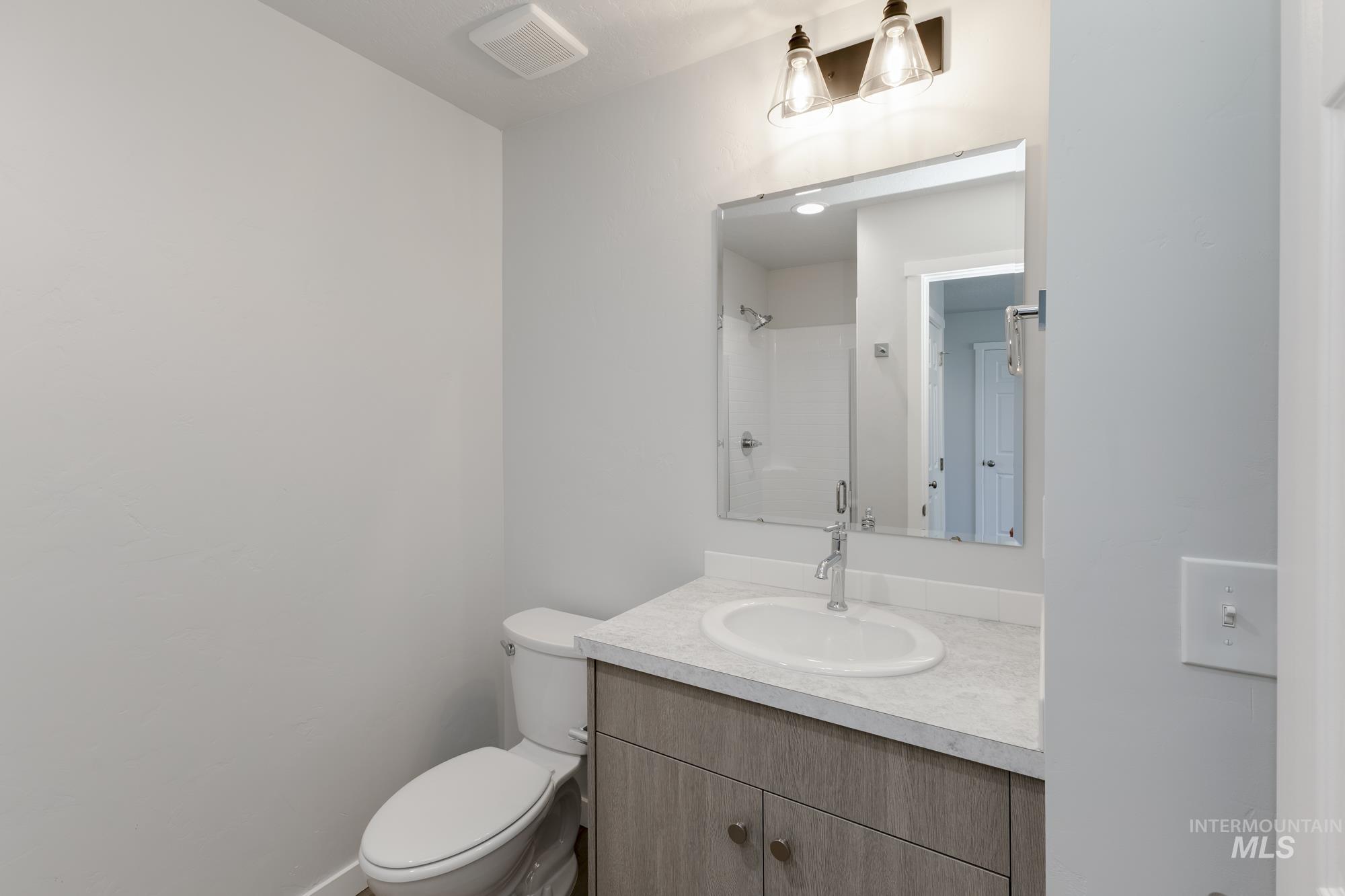 16366 Backfill Avenue Caldwell, ID 83607 - Photo 12 of 24 Full bath featuring vanity and a shower