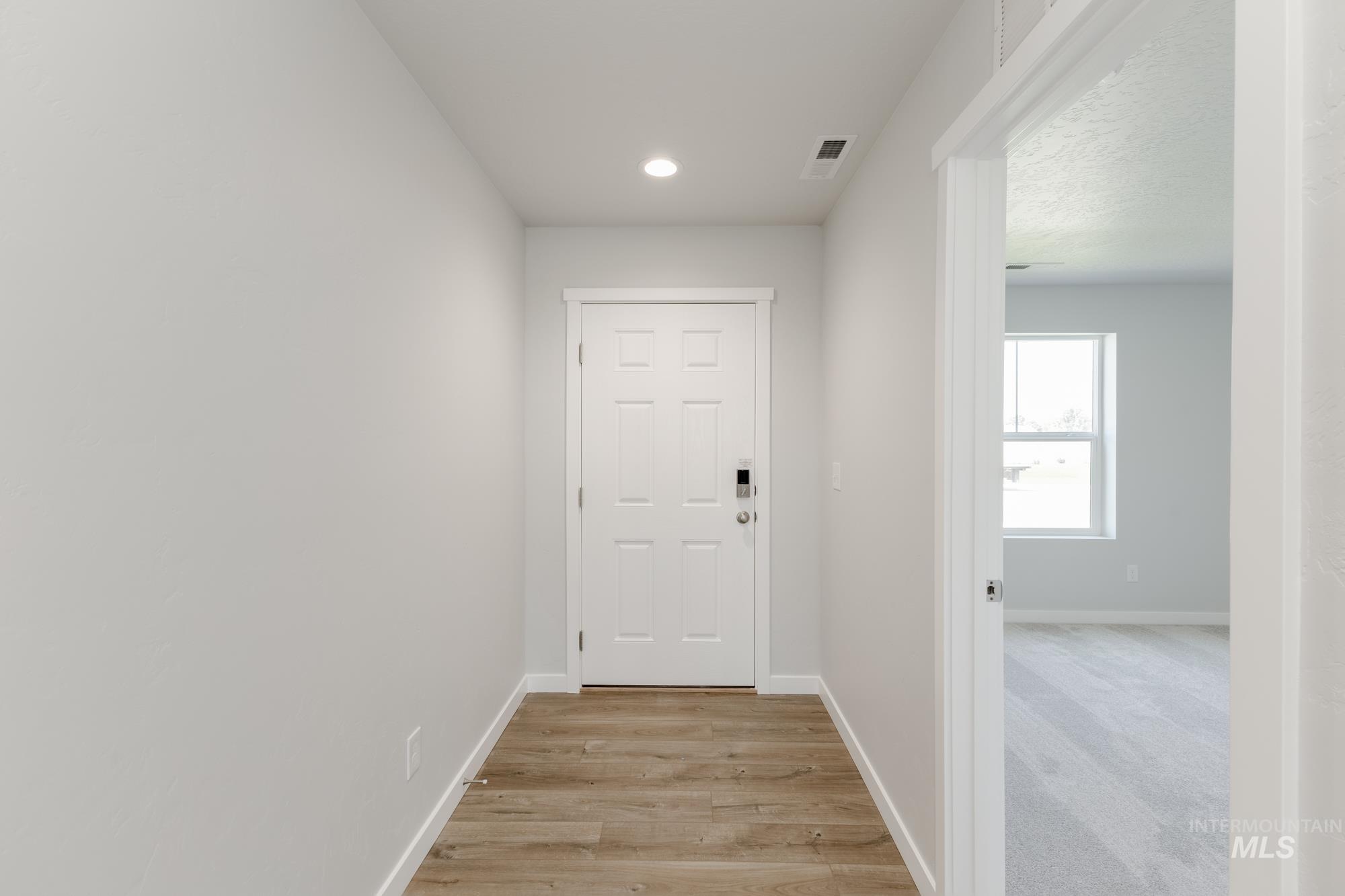 16366 Backfill Avenue Caldwell, ID 83607 - Photo 3 of 24 Corridor featuring recessed lighting and light wood-style floors
