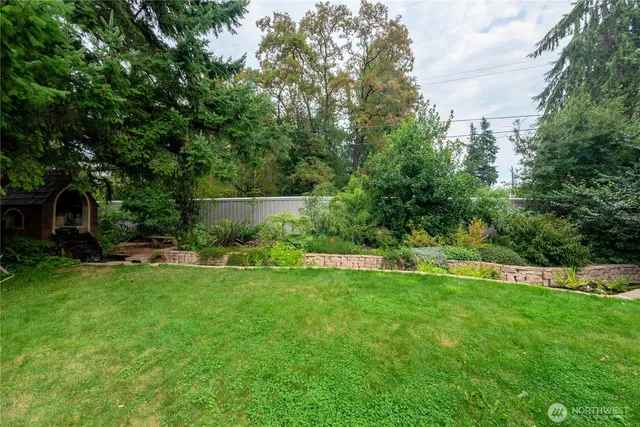 a view of a backyard with sitting area