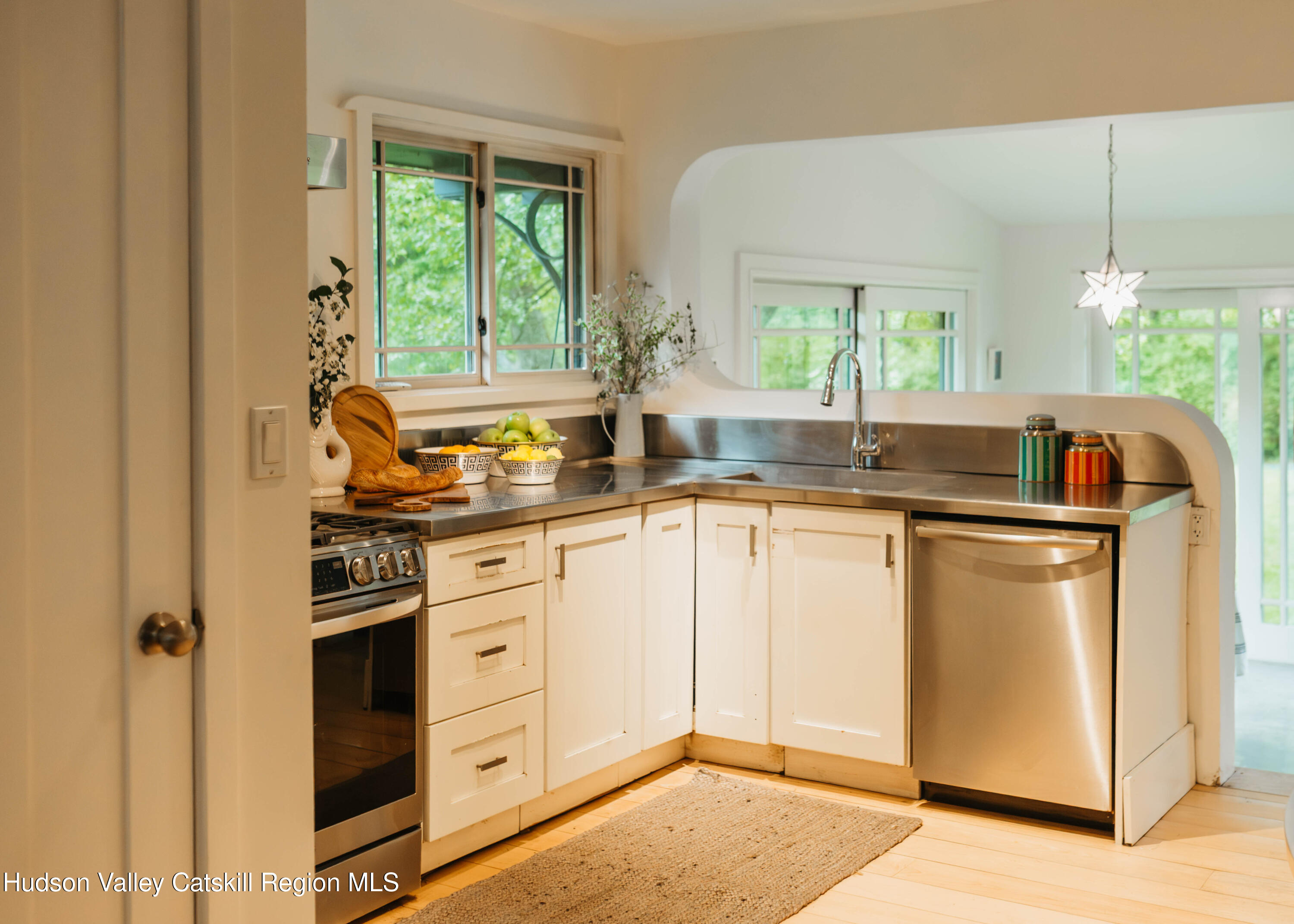 675 Cooper Lake Road Woodstock, NY 12448 - Photo 21 of 31 a kitchen with white cabinets and window