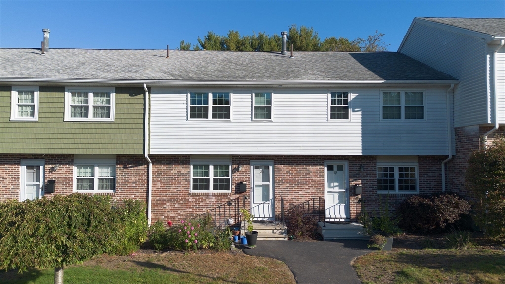 20 Hemlock Circle, Unit 20 Millis, MA 02054 - Photo 1 of 24 a front view of a house with garden