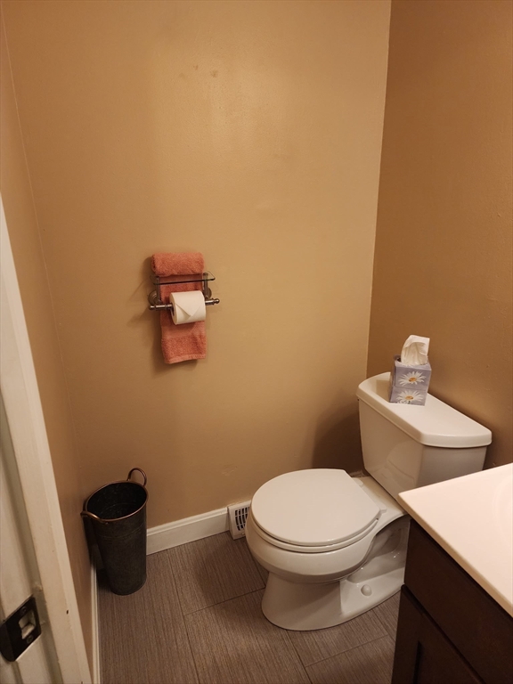 20 Hemlock Circle, Unit 20 Millis, MA 02054 - Photo 11 of 24 a white toilet sitting next to a bathroom sink