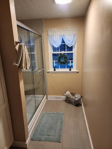 a view of a room with rack and window