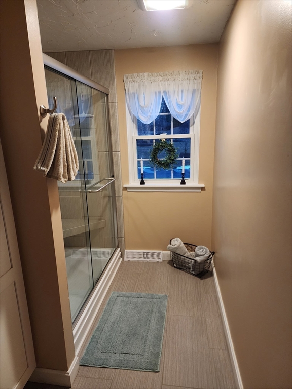 20 Hemlock Circle, Unit 20 Millis, MA 02054 - Photo 15 of 24 a view of a room with rack and window