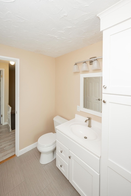 20 Hemlock Circle, Unit 20 Millis, MA 02054 - Photo 16 of 24 a bathroom with a sink a toilet and shower