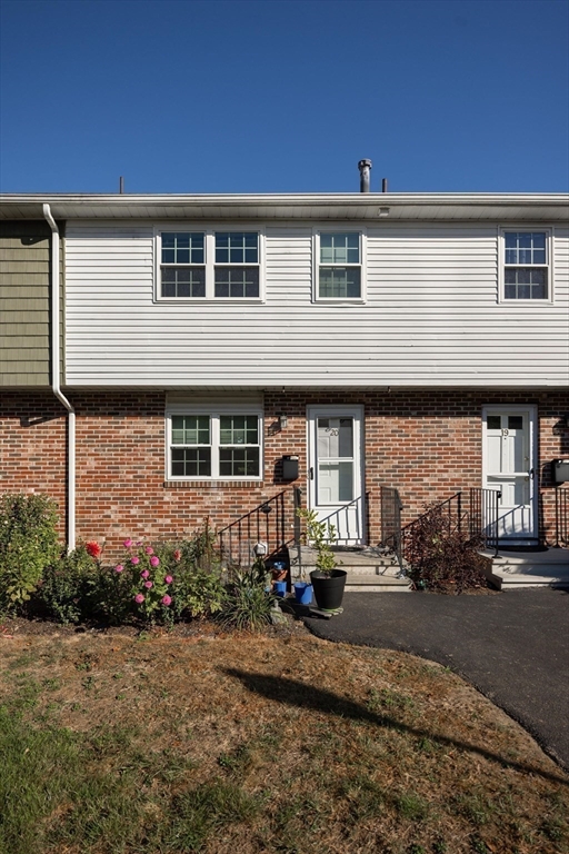 20 Hemlock Circle, Unit 20 Millis, MA 02054 - Photo 2 of 24 a front view of a house with a yard