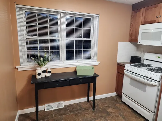 a room that has a dresser and a chair in it