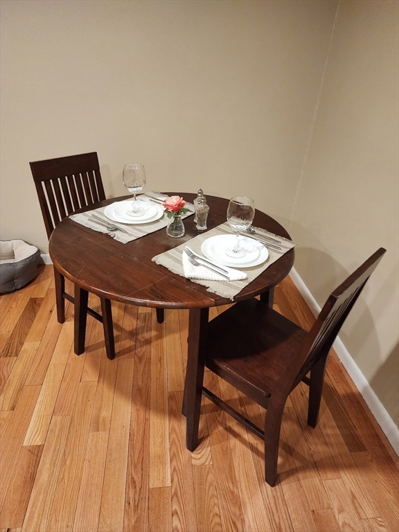 20 Hemlock Circle, Unit 20 Millis, MA 02054 - Photo 6 of 24 a view of a dining room with furniture and wooden floor