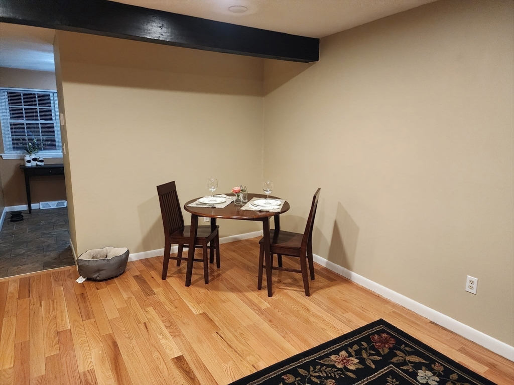 20 Hemlock Circle, Unit 20 Millis, MA 02054 - Photo 7 of 24 a view of a dining room with furniture and wooden floor