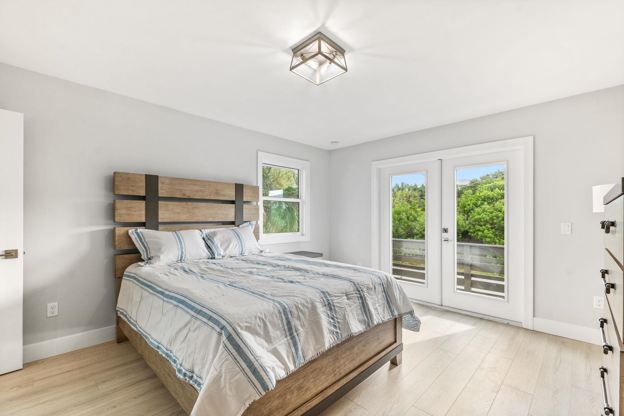 5348 Pelican Way St. Augustine, FL 32080 - Photo 12 of 46 a bedroom with a large bed and a window