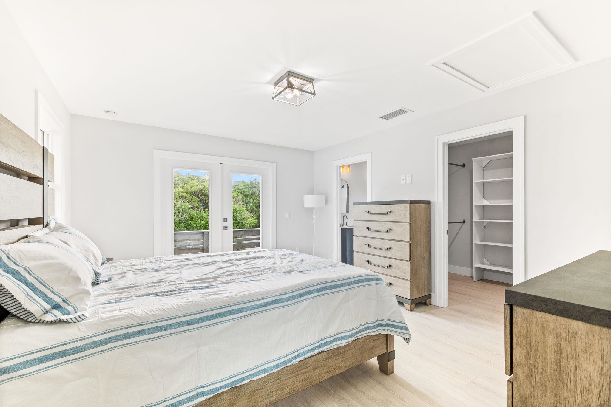 5348 Pelican Way St. Augustine, FL 32080 - Photo 13 of 46 a bedroom with a bed and a television