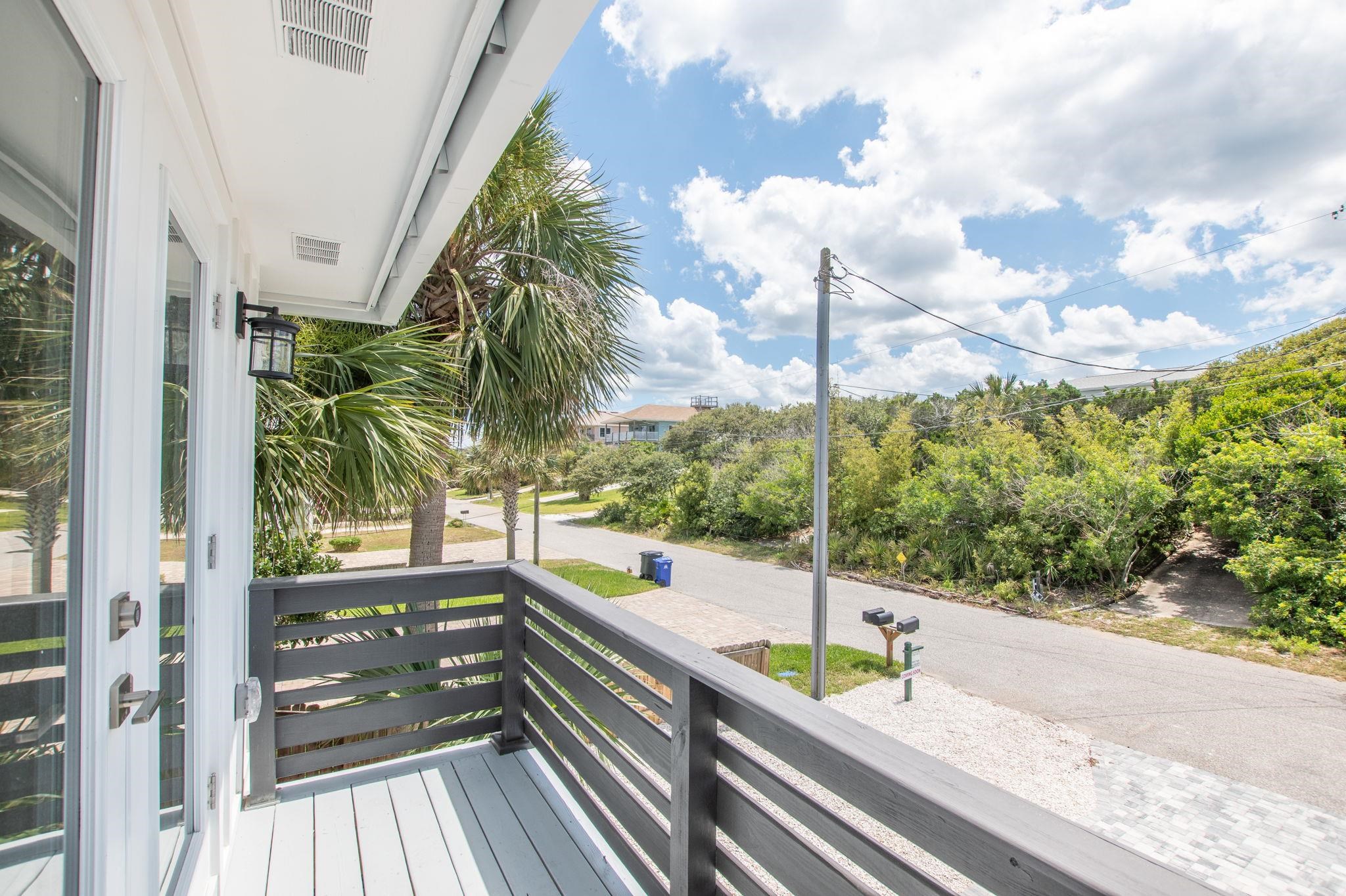 5348 Pelican Way St. Augustine, FL 32080 - Photo 19 of 46 a view of a balcony with floor to ceiling windows with wooden floor