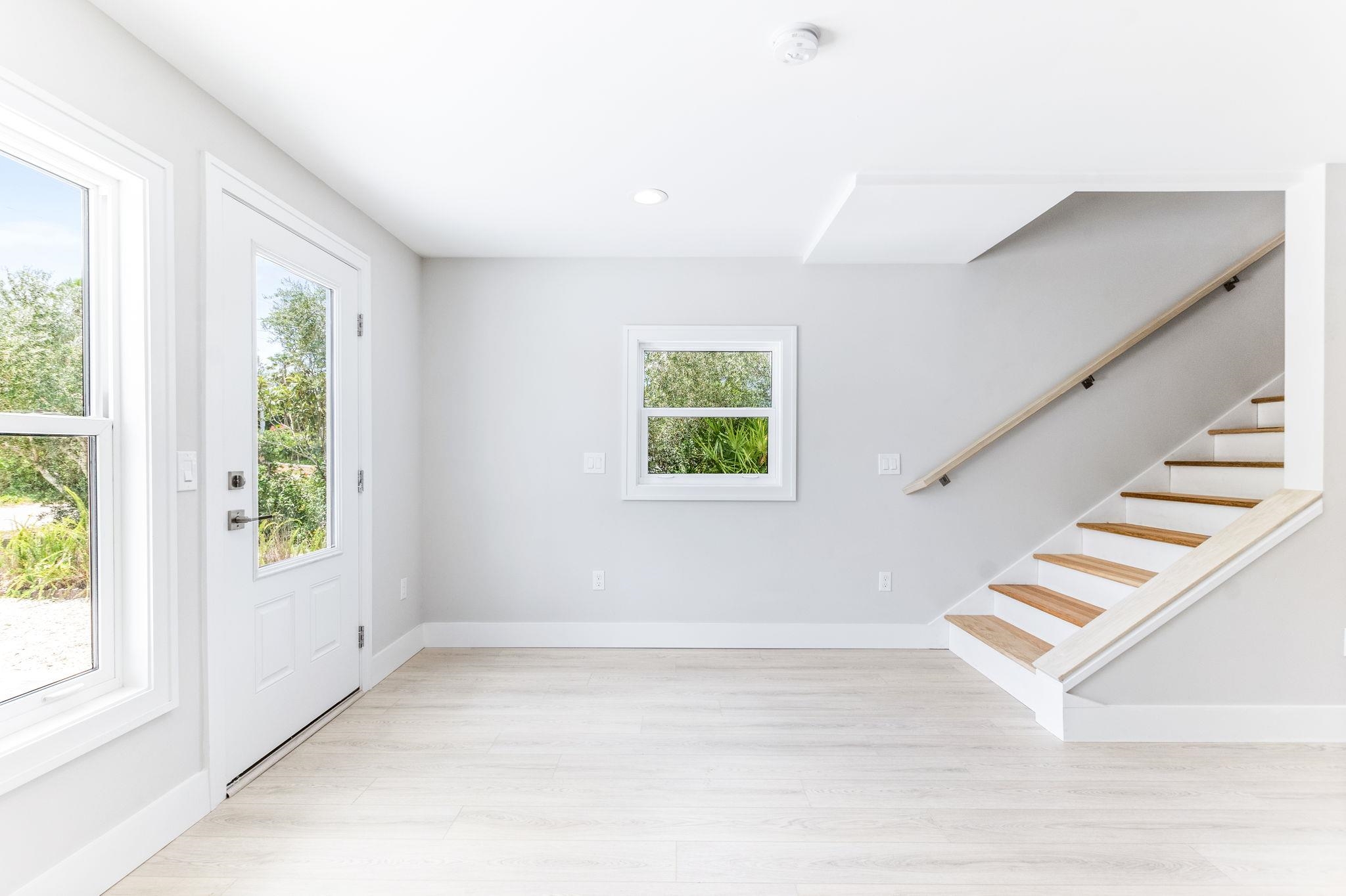 5348 Pelican Way St. Augustine, FL 32080 - Photo 20 of 46 a view of entryway and hall with wooden floor
