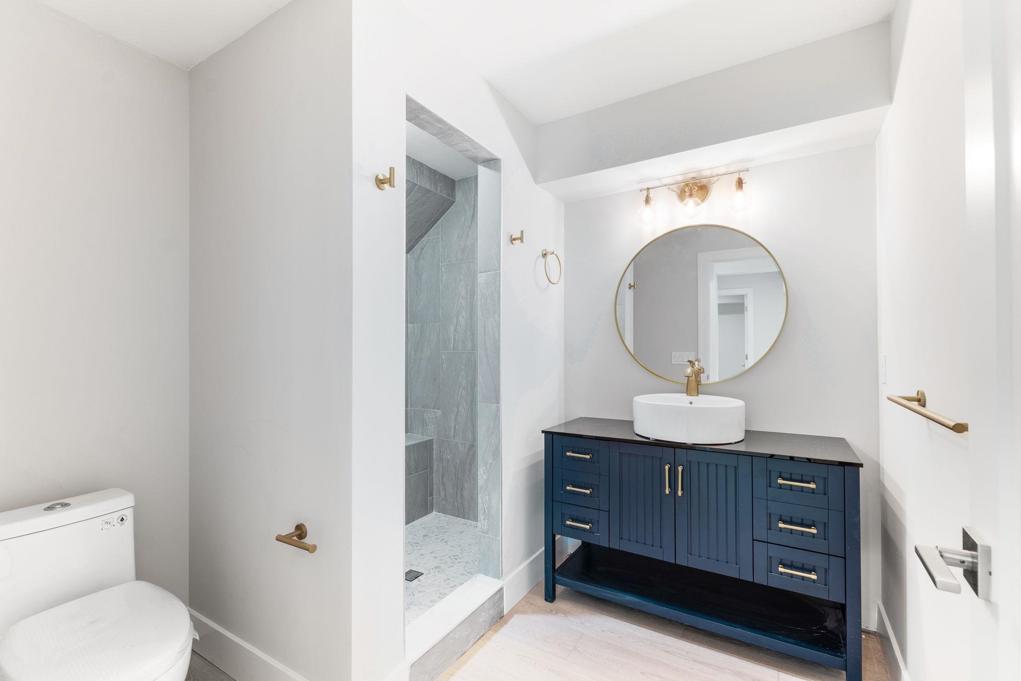 5348 Pelican Way St. Augustine, FL 32080 - Photo 29 of 46 a bathroom with a toilet a sink and a mirror