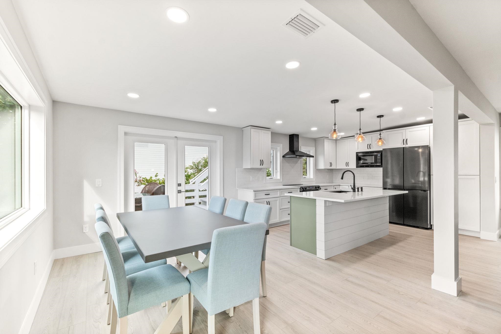 5348 Pelican Way St. Augustine, FL 32080 - Photo 7 of 46 a view of kitchen with refrigerator stove dining table and chairs