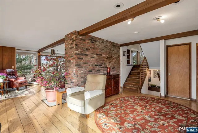 a view of an entryway with wooden floor