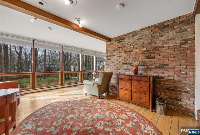 a room with furniture and large windows