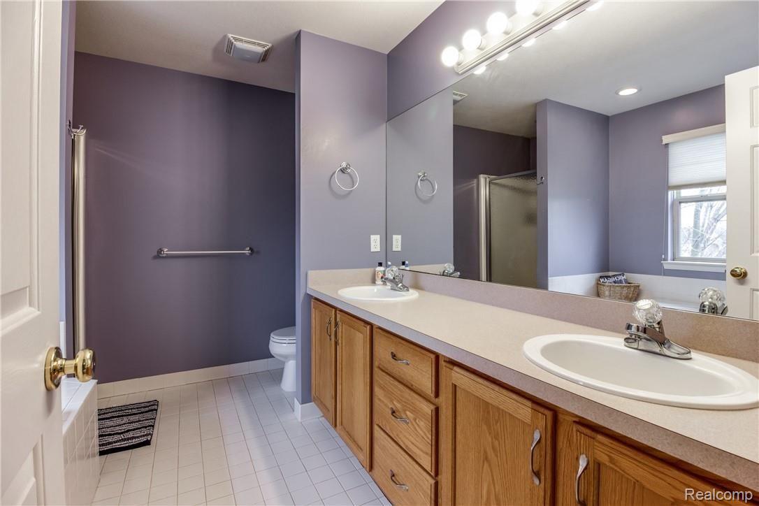 1455 Andover Boulevard Howell, MI 48843 - Photo 50 of 63 Master bath with dual sinks, separate shower and jetted tub