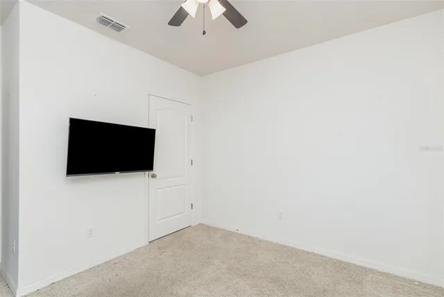 a view of a livingroom with a flat screen tv