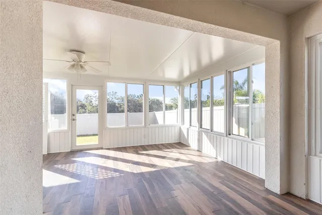 a view of an empty room with a window