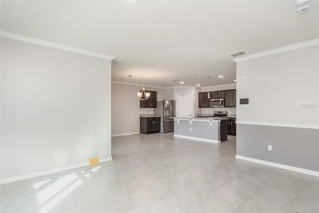 a view of a kitchen with microwave and stove