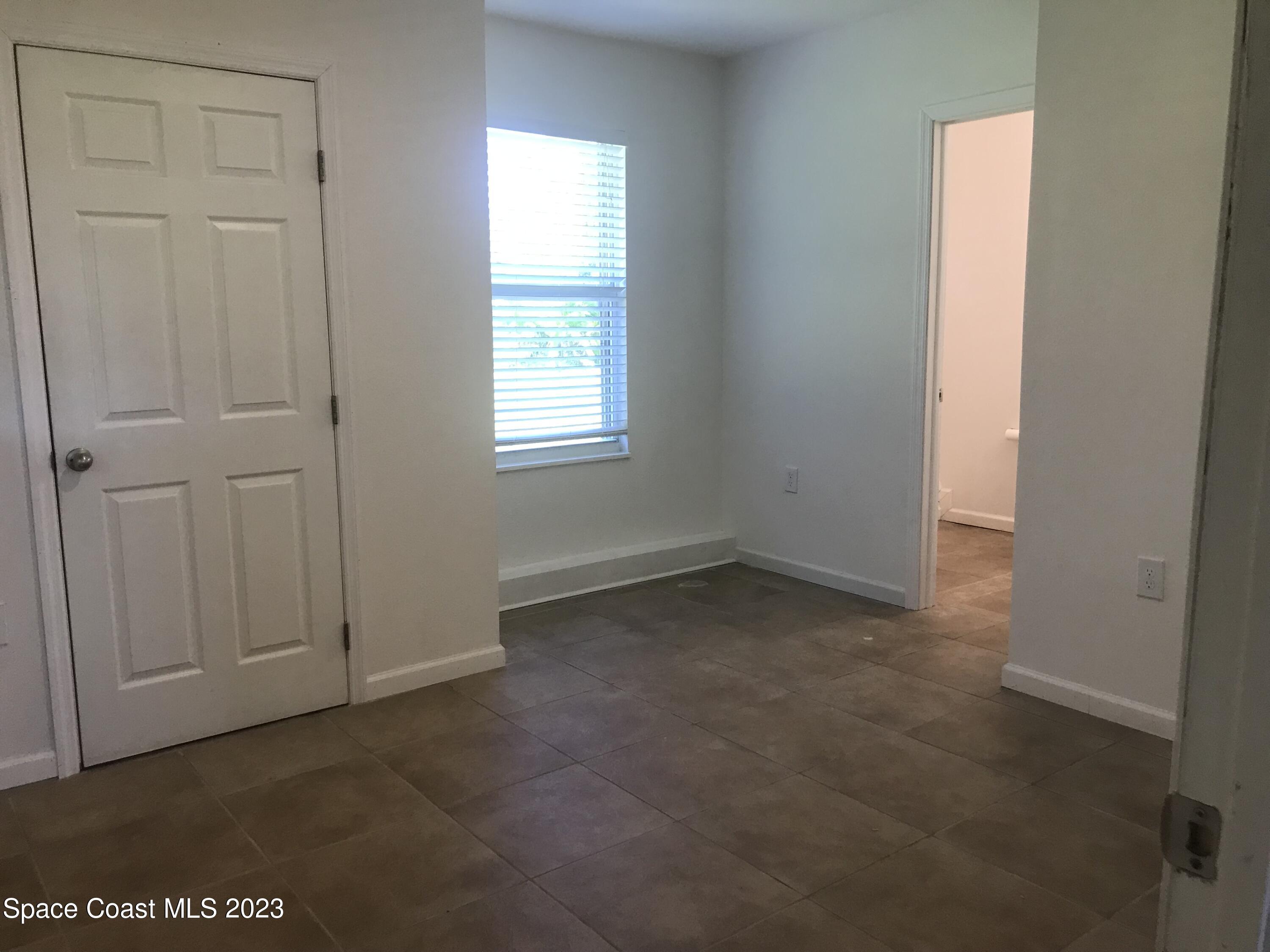 2525 Malabar Road Malabar, FL 32950 - Photo 12 of 30 a view of an empty room with a window