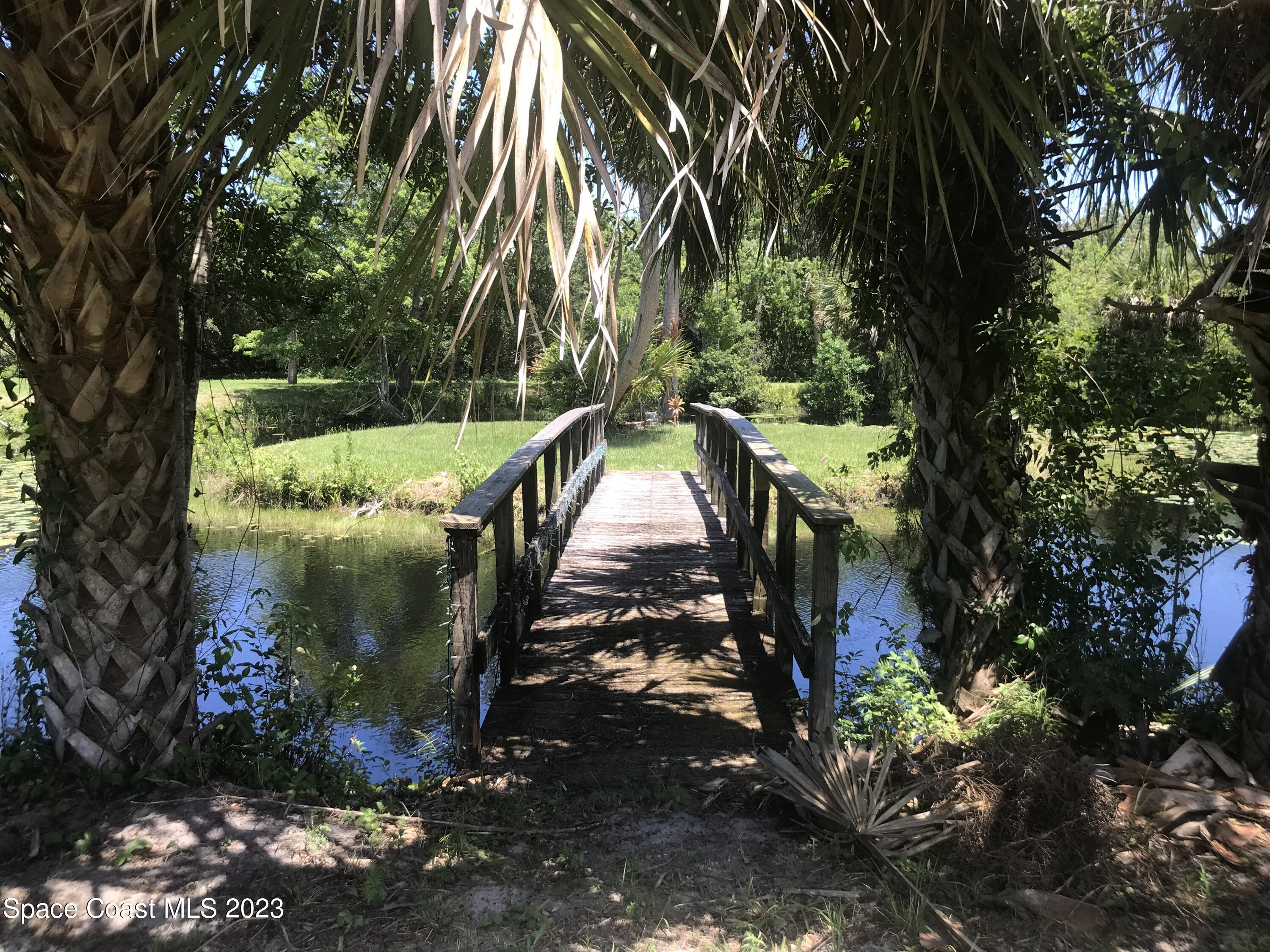 2525 Malabar Road Malabar, FL 32950 - Photo 21 of 30 a view of a fountain in the yard