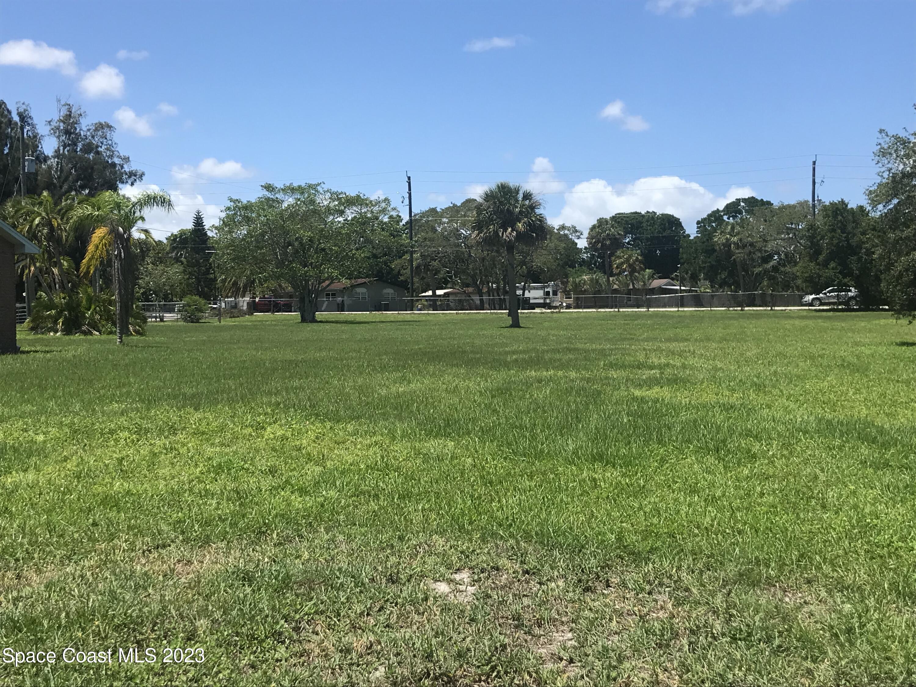 2525 Malabar Road Malabar, FL 32950 - Photo 26 of 30 a view of field with trees in the background